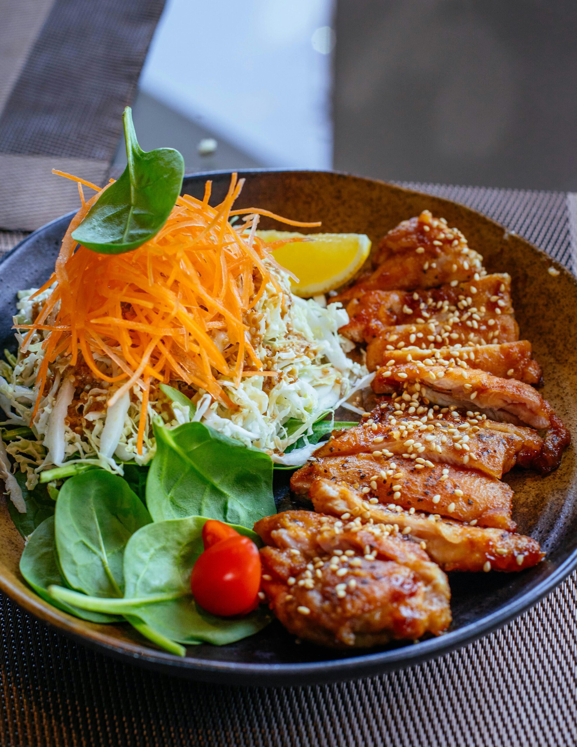 Vibrant Asian salad with grilled chicken, perfect for healthy eating enthusiasts.